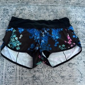 size 6 lululemon running shorts with built in briefs and zip back pocket